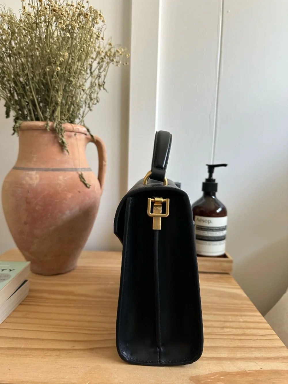 Quince black leather top-handle bag